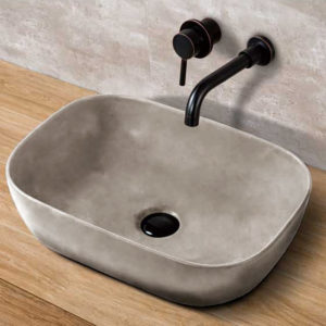 lavabo de hormigón con grifo negro